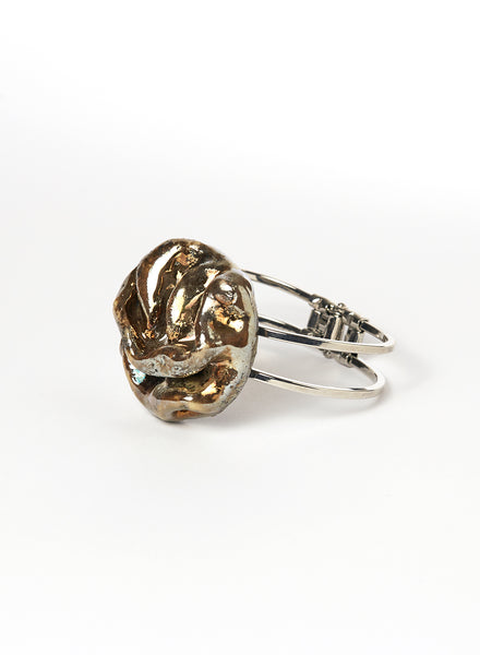 Bracciale Materia rigido in lega con gioiello con morbide pieghe color oro