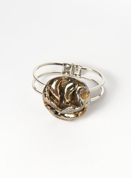 Bracciale Materia rigido in lega con gioiello con morbide pieghe color oro