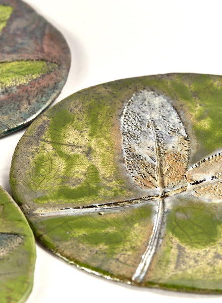 Quadretti verde e rame in ceramica raku